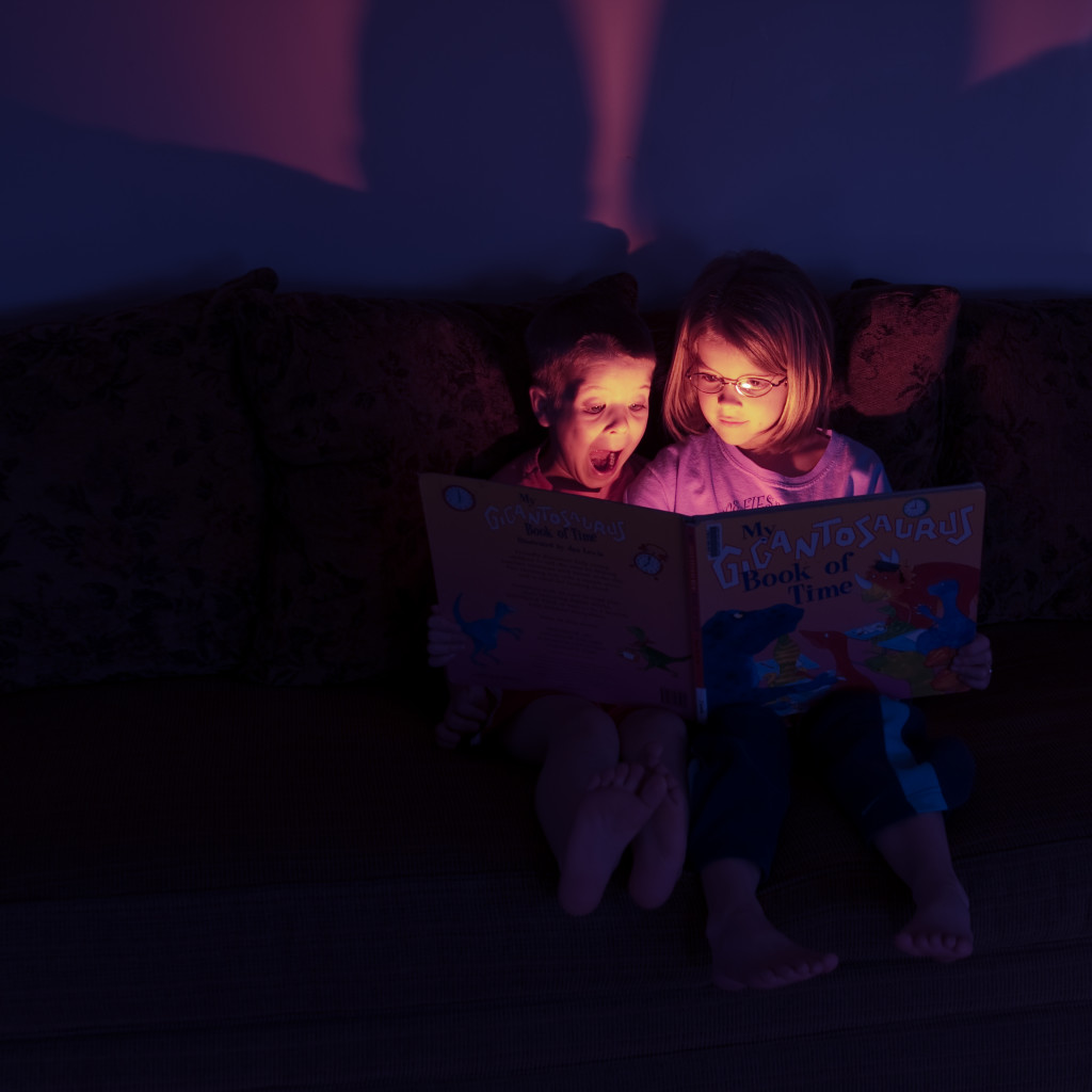 Two children reading a book